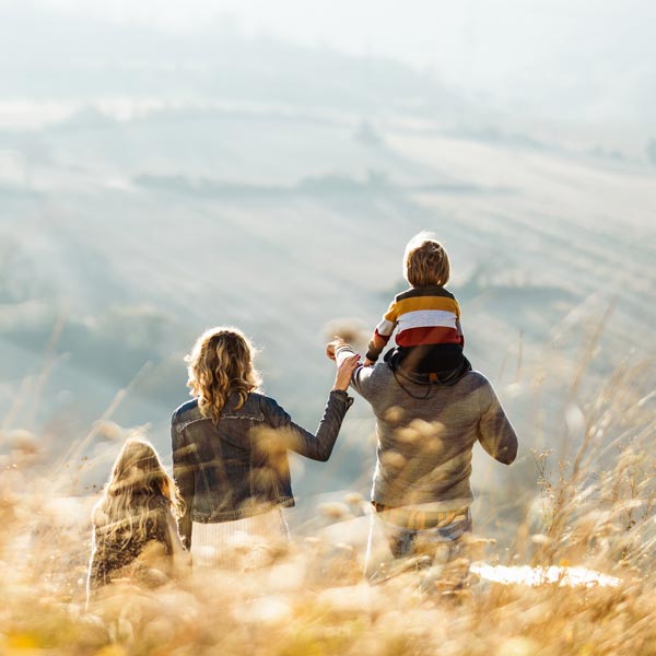 family overlooking fields