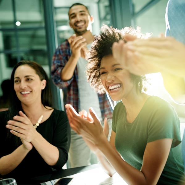 people clapping at workplace